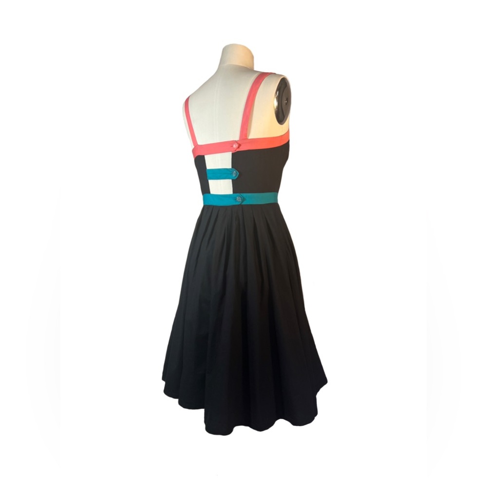 Anthropologie dress with unique button strap back.
